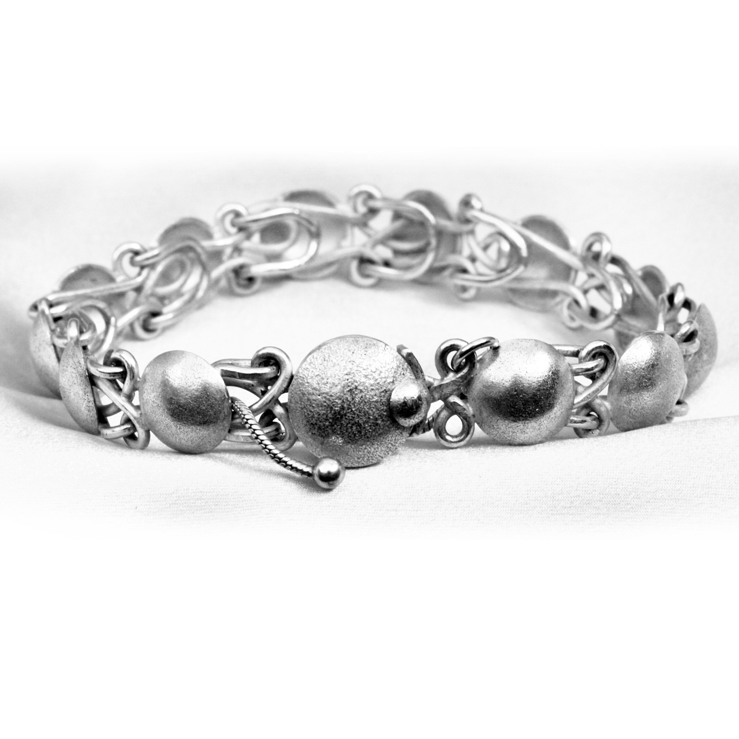 Harriet Walford Bracelet 2021 wire and stippled domes.